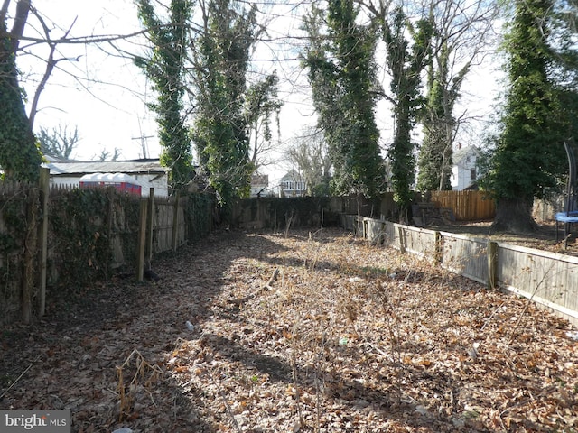 view of yard featuring a trampoline