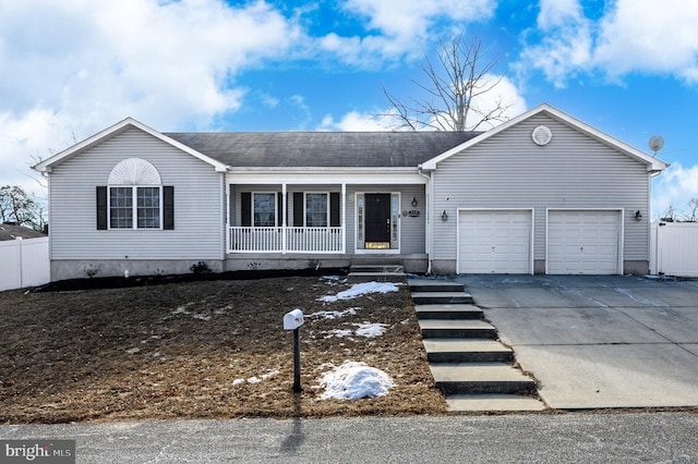 view of front of home featuring a garage and a porch