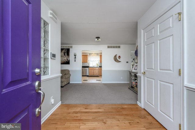 foyer entrance featuring light wood-type flooring