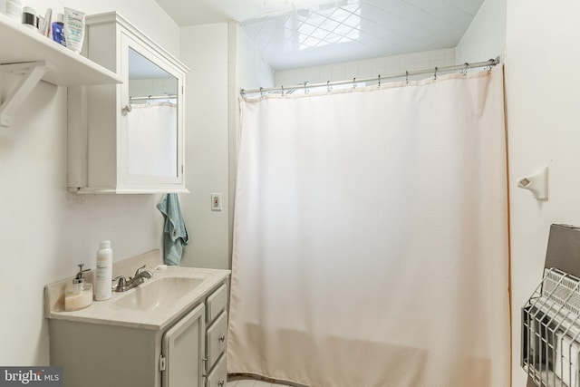 bathroom with vanity and a shower with curtain