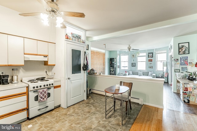 kitchen featuring electric stove, ceiling fan, white cabinetry, kitchen peninsula, and light wood-type flooring