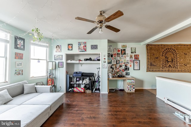 living room featuring a baseboard heating unit, dark wood-type flooring, and ceiling fan