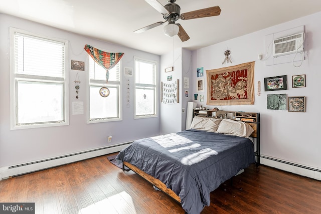 bedroom featuring dark wood-type flooring, a wall mounted air conditioner, and a baseboard heating unit