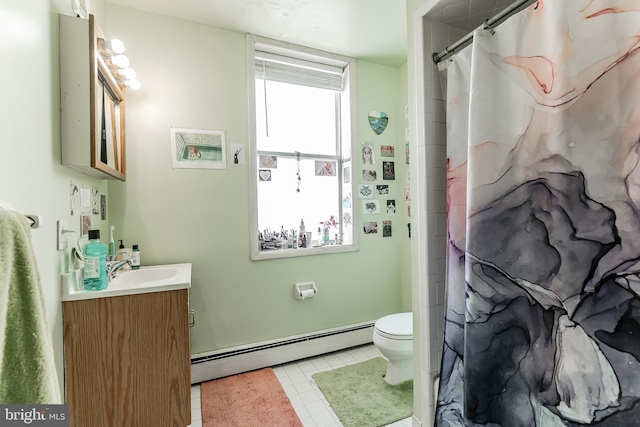 bathroom featuring a baseboard radiator, vanity, tile patterned floors, and toilet