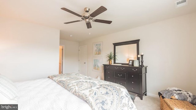 bedroom with light colored carpet and ceiling fan