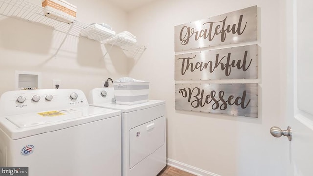 washroom with independent washer and dryer