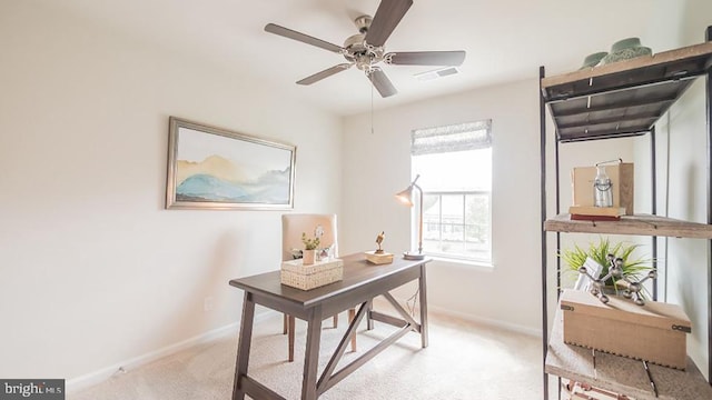 carpeted office featuring ceiling fan