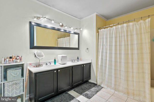 bathroom featuring tile patterned flooring, ornamental molding, and vanity