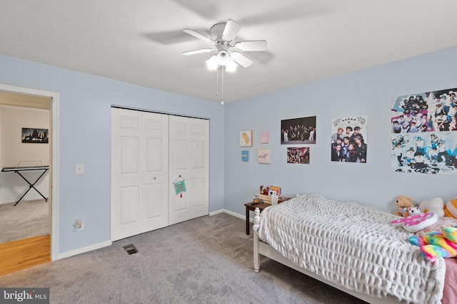 bedroom with carpet, ceiling fan, and a closet