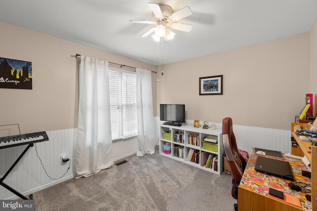 office space with carpet and ceiling fan