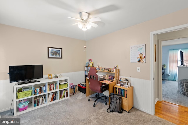 office featuring ceiling fan and light colored carpet