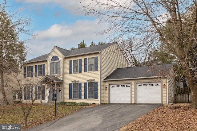 colonial home with a garage