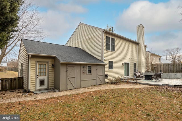 rear view of house featuring a patio and a lawn