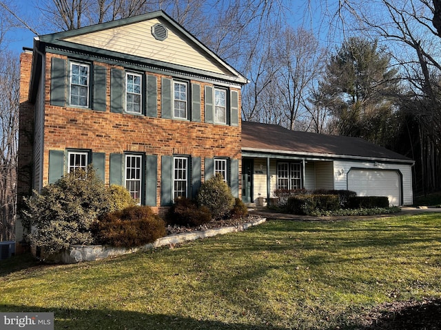 view of front facade featuring an attached garage, a chimney, a front lawn, and brick siding