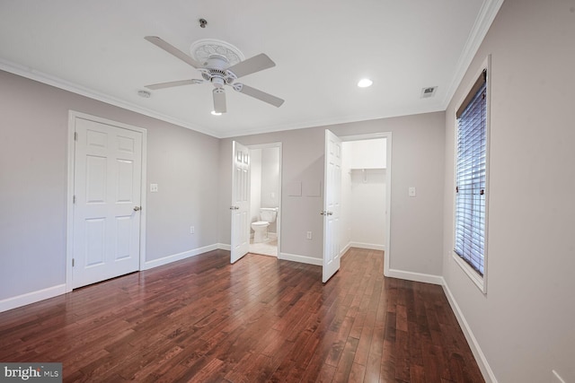 unfurnished bedroom featuring ornamental molding, visible vents, baseboards, and wood finished floors