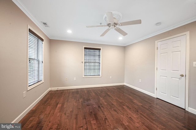 empty room featuring visible vents, baseboards, ceiling fan, ornamental molding, and dark wood-type flooring