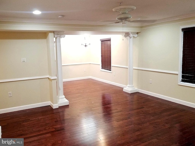 below grade area featuring ornamental molding, a ceiling fan, baseboards, and wood finished floors