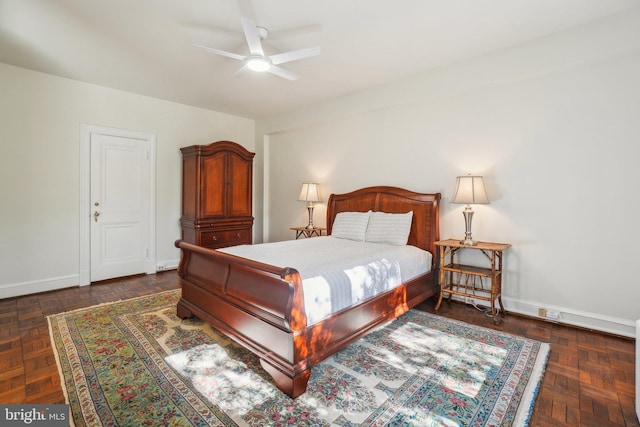 bedroom featuring baseboards and a ceiling fan