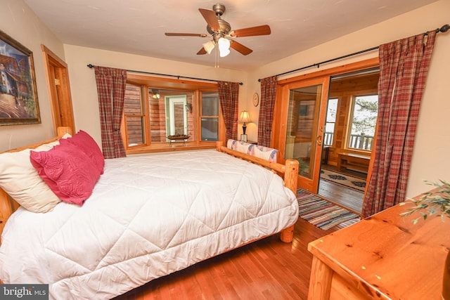 bedroom featuring wood-type flooring, access to outside, and ceiling fan