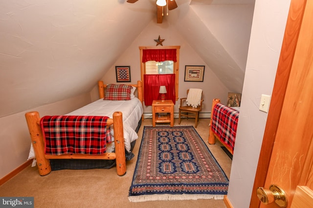 bedroom featuring lofted ceiling, carpet flooring, and ceiling fan