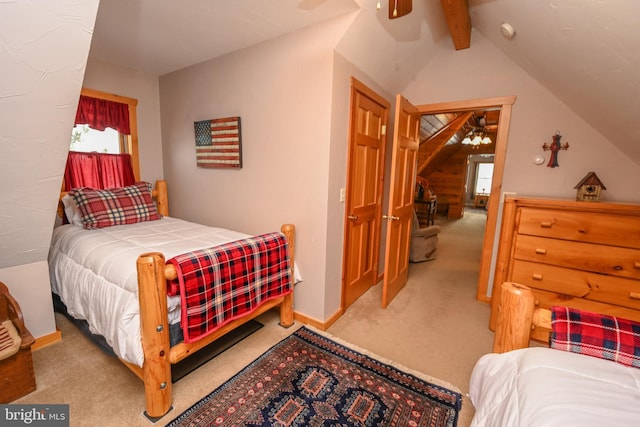 carpeted bedroom featuring vaulted ceiling with beams