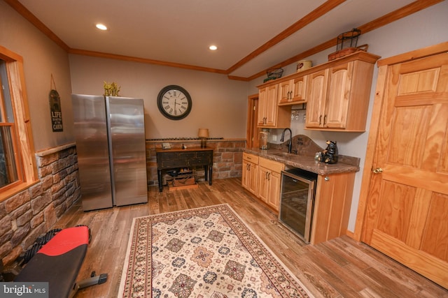 kitchen featuring light brown cabinetry, sink, ornamental molding, stainless steel fridge, and beverage cooler