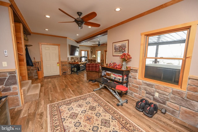 living room with crown molding and wood-type flooring