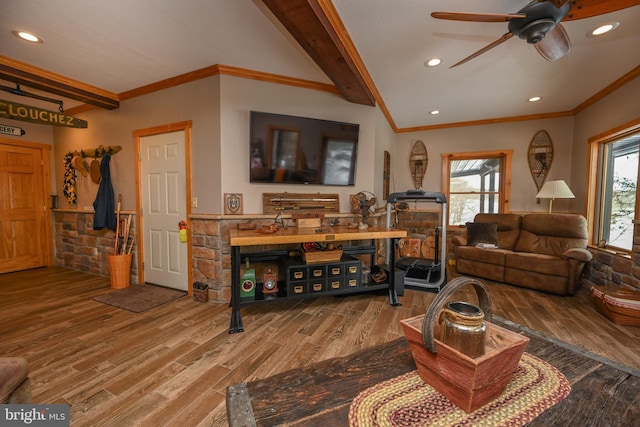 living room featuring crown molding, ceiling fan, wood-type flooring, and lofted ceiling with beams