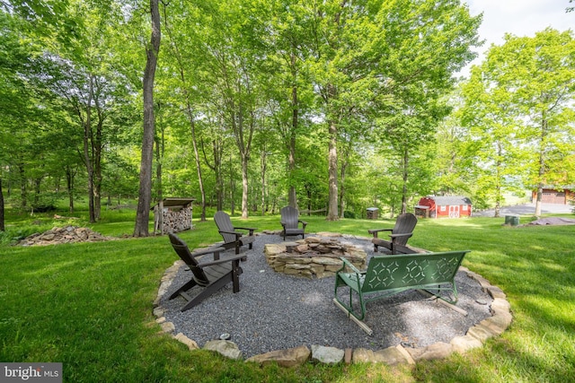 view of yard with an outdoor fire pit