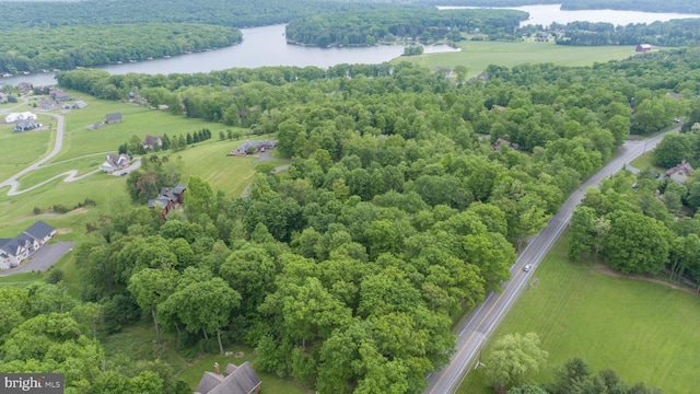 birds eye view of property with a rural view and a water view