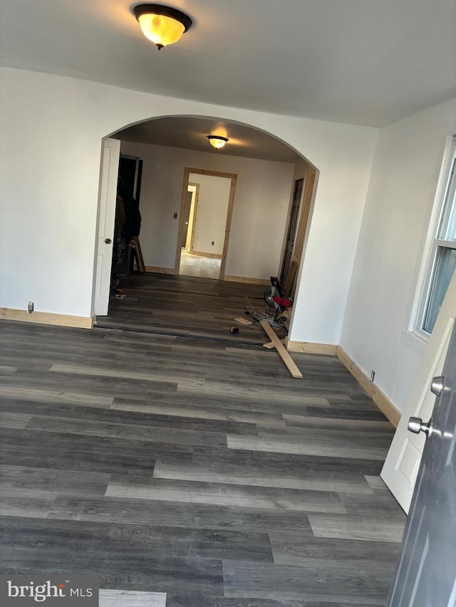 hallway with dark wood-type flooring