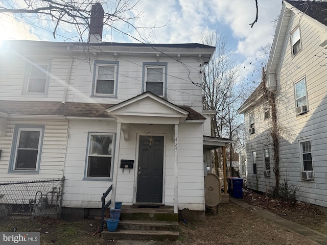 view of front of property with cooling unit