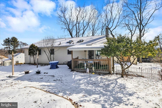 view of snow covered house