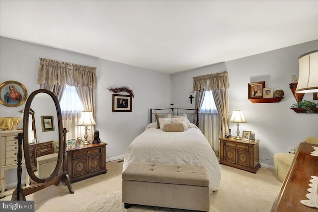 bedroom with light colored carpet