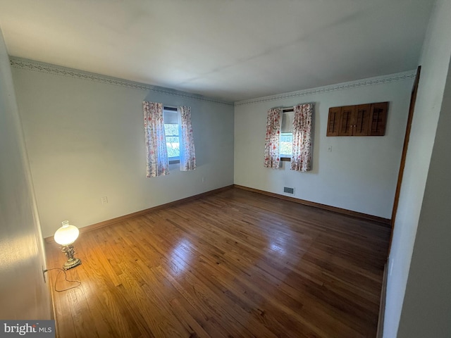 empty room with hardwood / wood-style floors