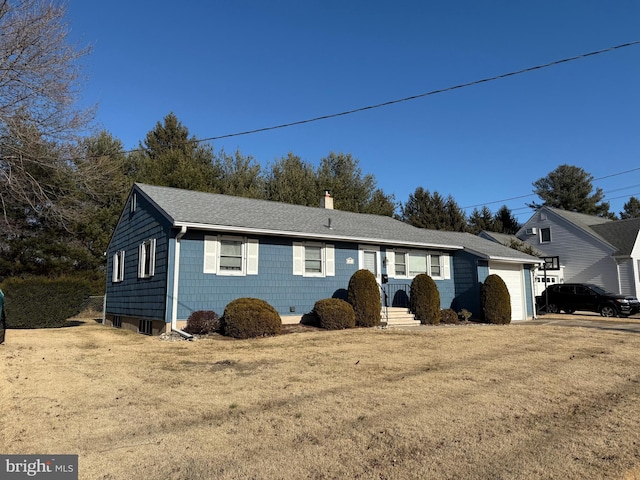 ranch-style house with a front yard