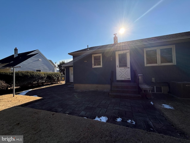 back of house with cooling unit and a patio area