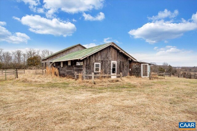 view of property exterior featuring a lawn