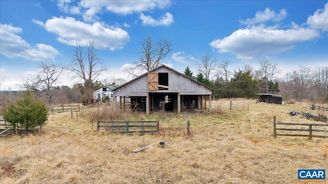 view of outdoor structure with a rural view