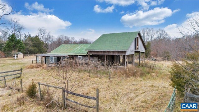 view of outbuilding featuring a rural view