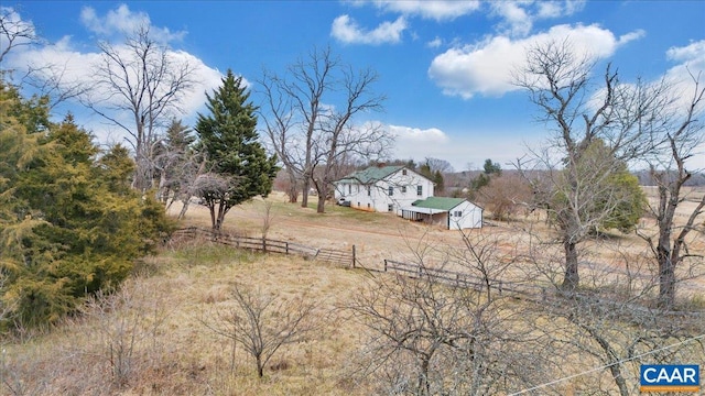 view of yard with a rural view