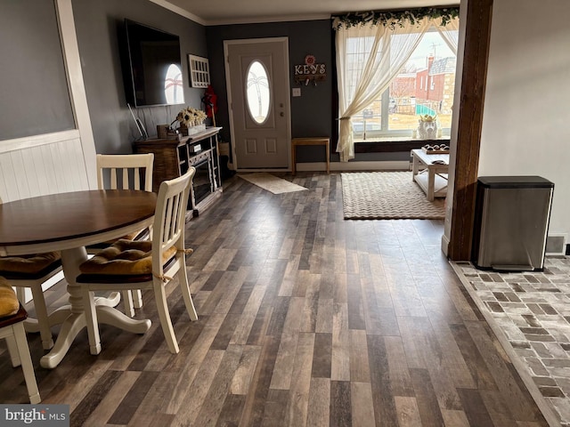 foyer with crown molding and dark hardwood / wood-style floors