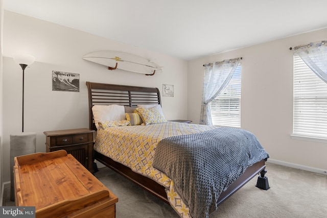 bedroom featuring carpet flooring and multiple windows