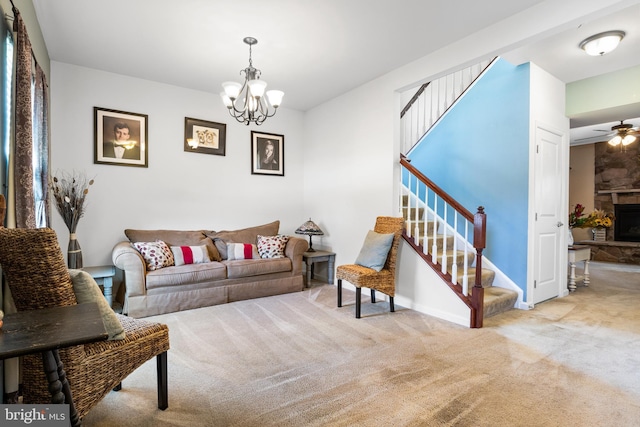 living room featuring a stone fireplace, light colored carpet, and a notable chandelier