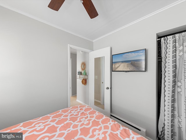 carpeted bedroom featuring crown molding, ceiling fan, and a baseboard radiator