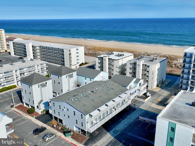 bird's eye view with a water view and a view of the beach