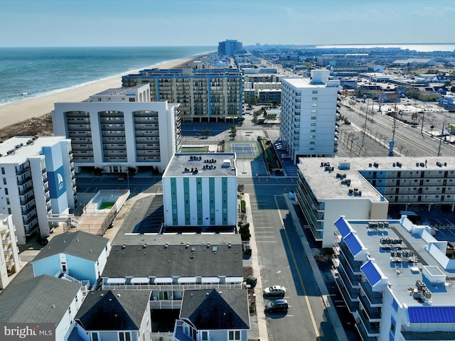 birds eye view of property with a view of the beach and a water view