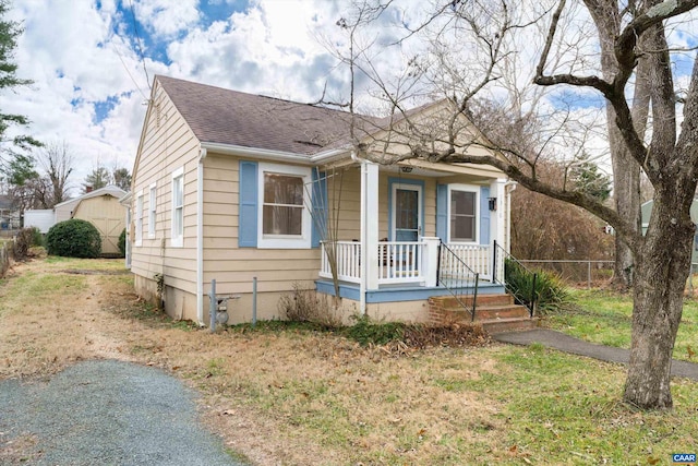 bungalow-style house with a front yard