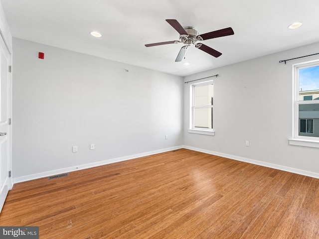 unfurnished room featuring ceiling fan and light hardwood / wood-style floors