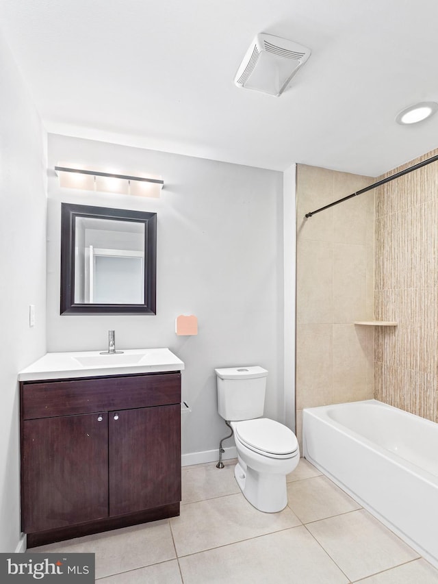 full bathroom featuring vanity, tiled shower / bath, tile patterned floors, and toilet